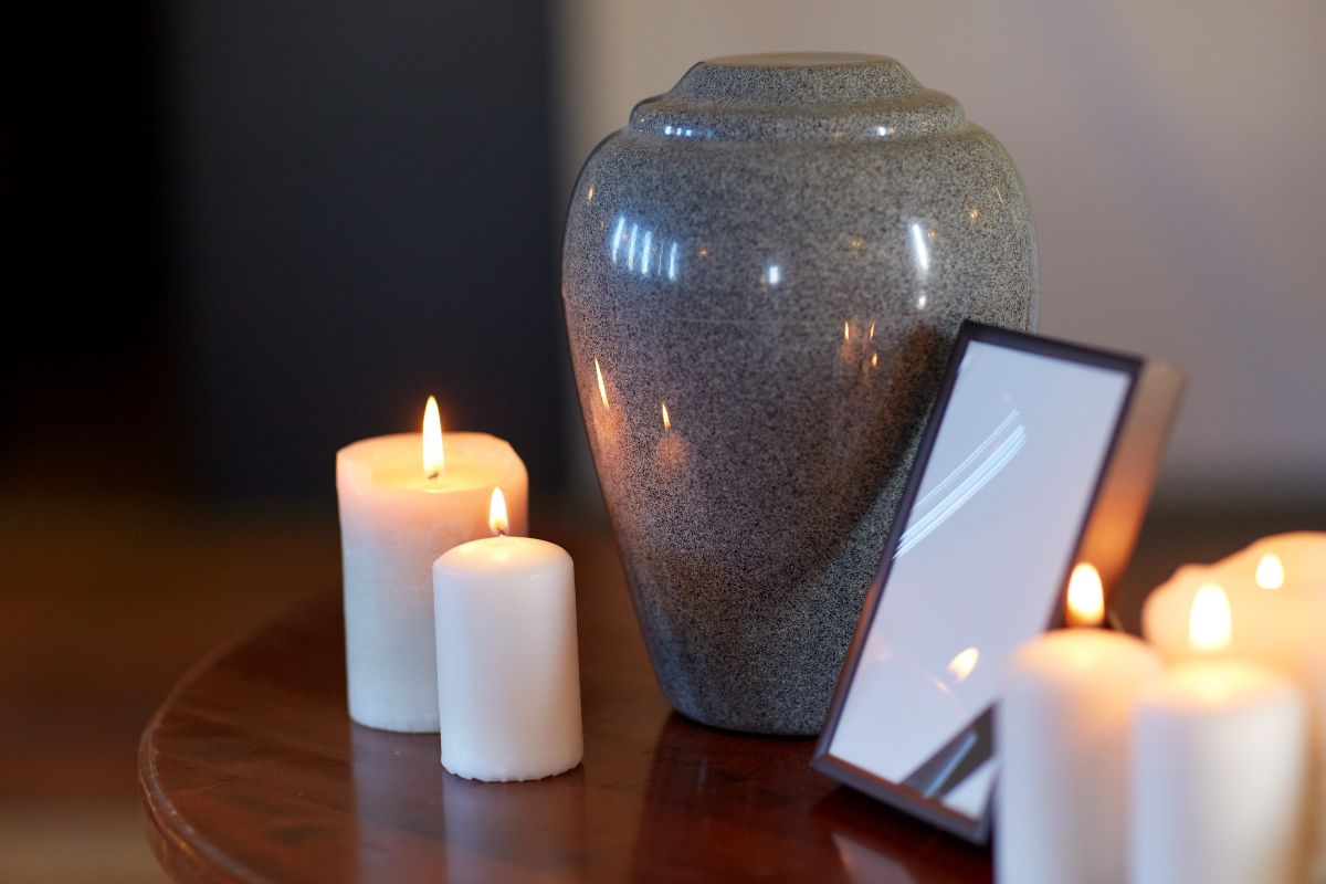 Cremation urn with candles in remembrance